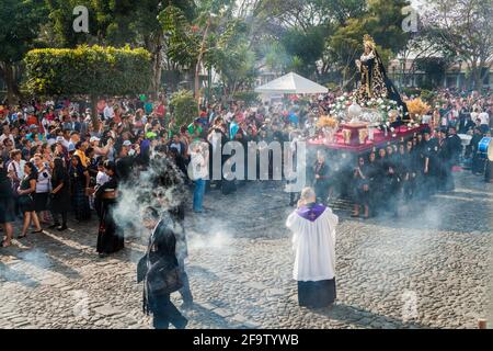 ANTIGUA, GUATEMALA - MARCH 26, 2016: Participants of the procession on Holy Saturday Black Saturday in Antigua Guatemala town, Guatemala. Stock Photo