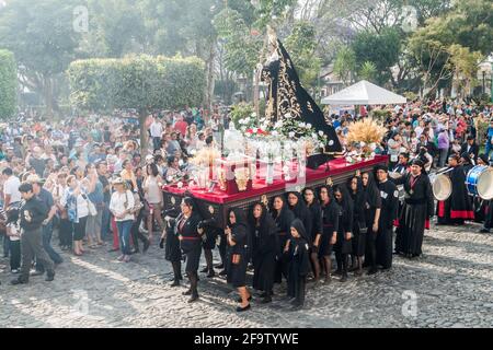 ANTIGUA, GUATEMALA - MARCH 26, 2016: Participants of the procession on Holy Saturday Black Saturday in Antigua Guatemala town, Guatemala. Stock Photo