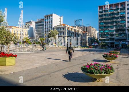 ATHENS, GREECE, DECEMBER 10, 2015: people are passing thorugh omonia square in athens Stock Photo