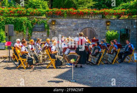 MEERSBURG, GERMANY, JULY 24, 2016: a group of german pensioners is enjoying traditional folk music on a street in the german city Meersburg. Stock Photo