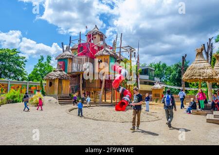 PRAGUE, CZECH REPUBLIC, APRIL 25, 2015: view of children playing on a giant plaground inside of the indonesian jungle pavillion in the zoo of prague Stock Photo