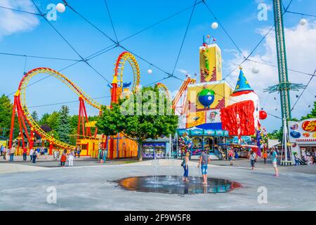 VIENNA, AUSTRIA, JUNE 2016: View of an orange roller coaster situated inside of the prater amusement park in Vienna, Austria. Stock Photo