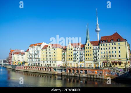 BERLIN, GERMANY, MARCH 12, 2015: view of the riverside of spree river in berlin with famous berlin fernsehturm above it. Stock Photo