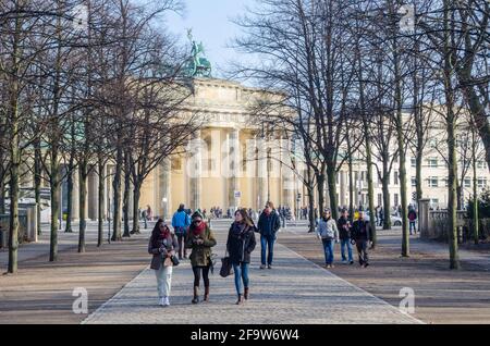 BERLIN, GERMANY, MARCH 12, 2015: people are going towards the reichstag building from the brandenburger tor in berlin. Stock Photo