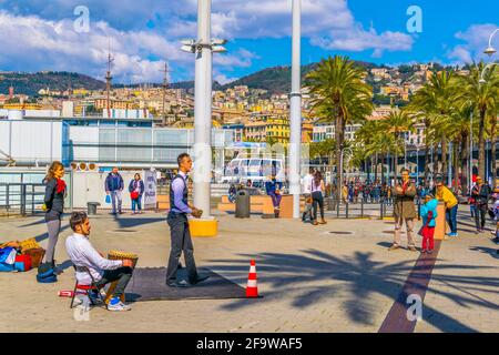 GENOA, ITALY, MARCH 13, 2016: people are admiring a jongler in the port of genoa. Stock Photo