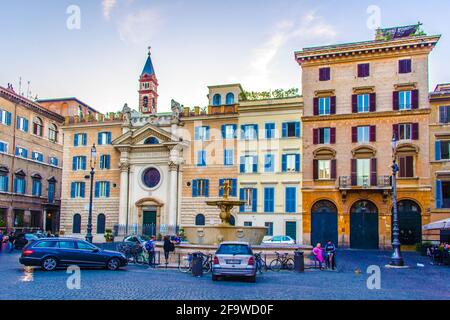 ROME, ITALY, JUNE 1, 2014: people are strolling through famous piazza farnese in italian capital rome. Stock Photo