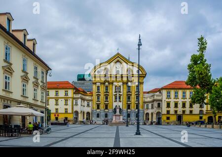 LJUBLJANA, SLOVENIA, JULY 29, 2015: view of the congress square (kongresni trg) in the slovenian capital ljubljana with the holy trinity church at the Stock Photo