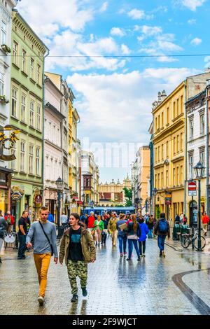 KRAKOW, POLAND, AUGUST 11, 2016: People are walking through Grodzka street in Krakow/Cracow, Poland. Stock Photo