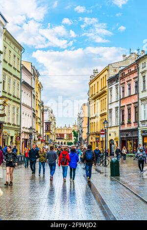 KRAKOW, POLAND, AUGUST 11, 2016: People are walking through Grodzka street in Krakow/Cracow, Poland. Stock Photo