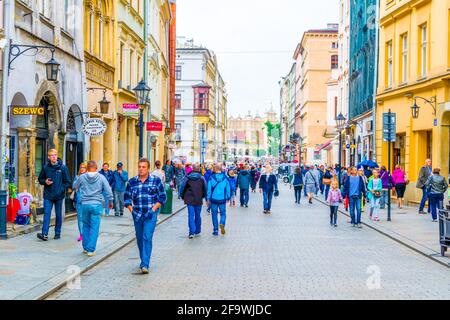 KRAKOW, POLAND, AUGUST 11, 2016: People are walking through Grodzka street in Krakow/Cracow, Poland. Stock Photo