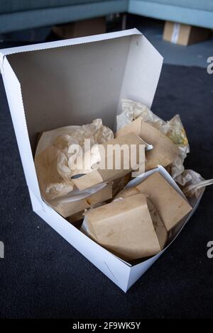 A stack of take away disposable food packages. Increase of waste and trash  from food delivery services during the covid 19 pandemic time. Stock Photo