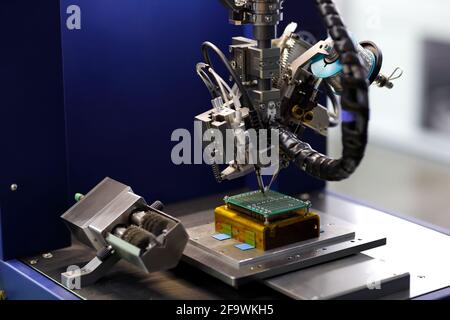Automatic soldering machine for printed circuit boards. Selective focus. Stock Photo