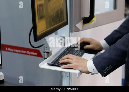 Quality test of printed circuit board on a modern X-Ray inspection system. Selective focus. Stock Photo