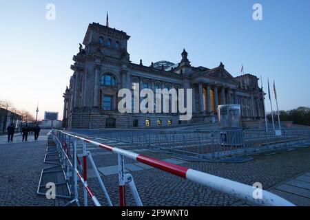 Berlin, Germany. 21st Apr, 2021. A double fence is erected in front of the Reichstag building. A demonstration against the Corona restrictions has been announced for today. Credit: Jörg Carstensen/dpa/Alamy Live News Stock Photo