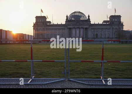 Berlin, Germany. 21st Apr, 2021. A fence is erected in front of the Reichstag building. A demonstration against the Corona restrictions has been announced for today. Credit: Jörg Carstensen/dpa/Alamy Live News Stock Photo