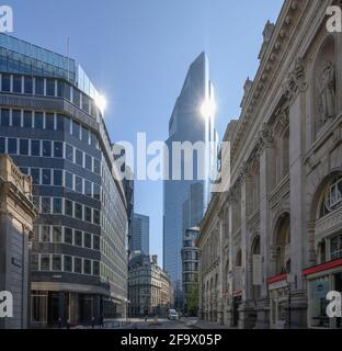 City of London, 20 April 2021. View along Threadneedle Street with 22 Bishopsgate skscraper in background reflecting the sun against a blue sky Stock Photo