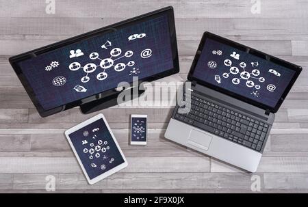 Social network concept shown on different information technology devices Stock Photo