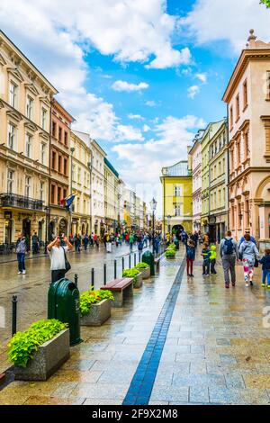 KRAKOW, POLAND, AUGUST 11, 2016: People are walking through Grodzka street in Krakow/Cracow, Poland. Stock Photo