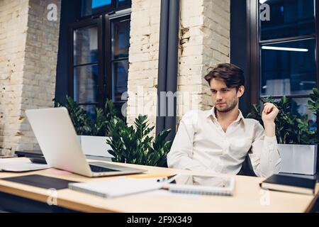 Concentrated businessman working on laptop Stock Photo