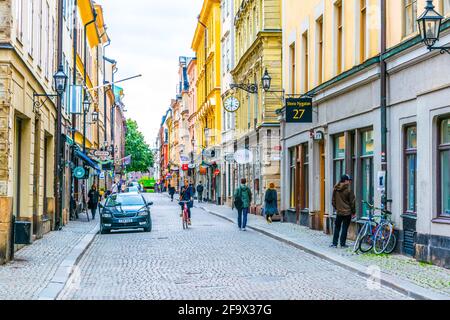 STOCKHOLM, SWEDEN, AUGUST 18, 2016: People are strolling on a street in the Gamla Stan district in central Stockholm, Sweden. Stock Photo