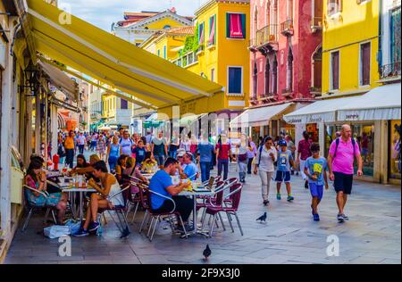 VENICE, ITALY, SEPTEMBER 20, 2015: people are strolling over strada nuova street in italian city venice, which belongs to the main streets of the city Stock Photo