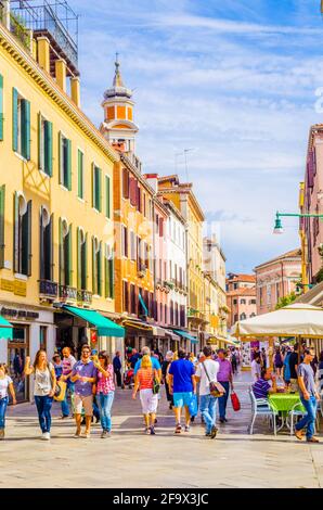 VENICE, ITALY, SEPTEMBER 20, 2015: people are strolling over strada nuova street in italian city venice, which belongs to the main streets of the city Stock Photo