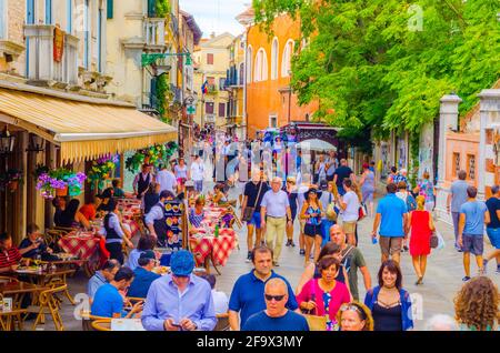 VENICE, ITALY, SEPTEMBER 20, 2015: people are strolling over strada nuova street in italian city venice, which belongs to the main streets of the city Stock Photo