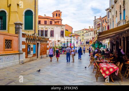 VENICE, ITALY, SEPTEMBER 20, 2015: people are strolling over strada nuova street in italian city venice, which belongs to the main streets of the city Stock Photo