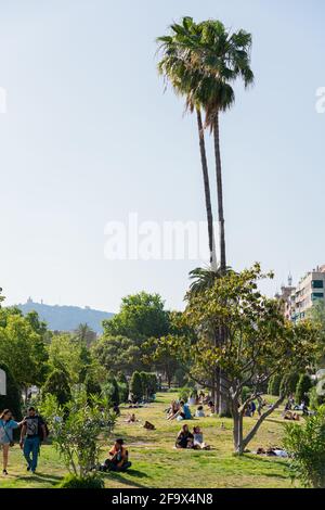BARCELONA, SPAIN - JUNE 08, 2019: People Having Picnic And Relaxing On Summer Day In Parc de la Ciutadella Or Citadel Park In Barcelona Stock Photo