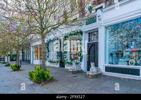 LONDON, UK - APRIL 11, 2021: Shops and businesses on Westbourne Grove,  Notting Hill in west London Stock Photo