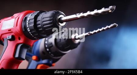 Composition with two cordless drills also working as screw guns Stock Photo