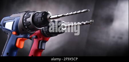 Composition with two cordless drills also working as screw guns Stock Photo