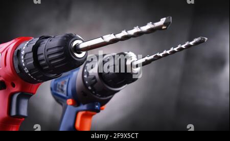 Composition with two cordless drills also working as screw guns Stock Photo