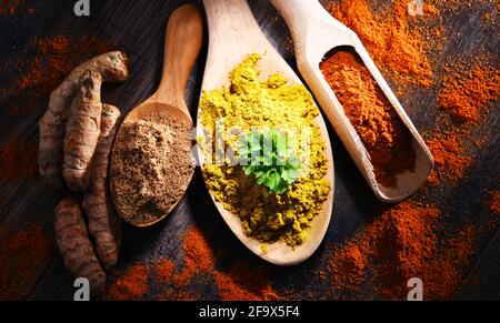 Composition with spices on wooden kitchen table. Stock Photo