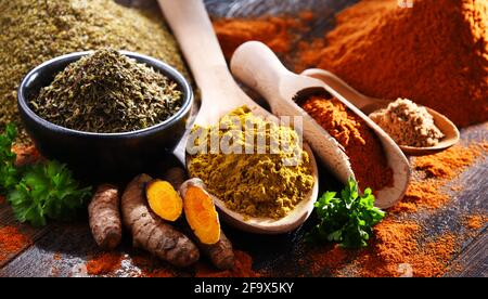 Composition with spices on wooden kitchen table. Stock Photo