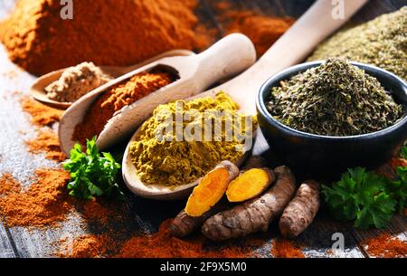 Composition with spices on wooden kitchen table. Stock Photo