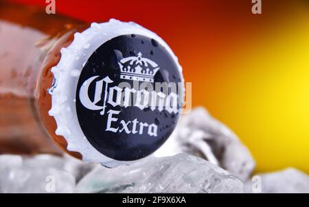 POZNAN, POL - FEB 25, 2021: Crown cap on a Corona Extra bottle, one of the top-selling beers worldwide, a pale lager produced by Cerveceria Modelo in Stock Photo