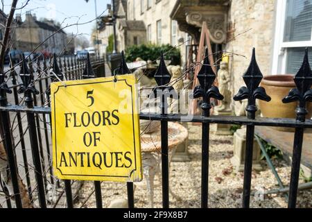 Spring sunshine in Tetbury a Cotswold town in Gloucestershire UK. Top Banana Antiques. Stock Photo