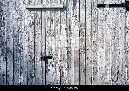 Peeling paint on nailed-shut doors, Deighton, North Yorkshire, UK Stock Photo