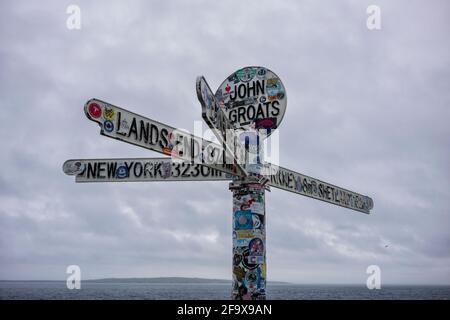 John O'Groats, UK - June 24, 2019: The landmark 'Journey's End' signpost at John o' Groats, a popular tourist attraction marking the furthest north on
