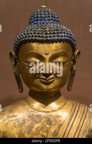 Gilded bronze Buddha statue of Sakyamuni, Yuan Dynasty (1271-1368). Capital Museum in Beijing, China. Stock Photo