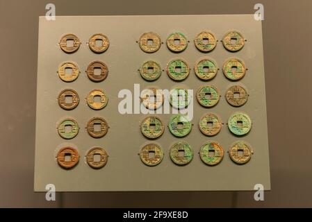 Right part - Kaiyuan Tongbao, bronze coins of the Tang Dynasty (618-907). Left - Five baht,  bronze coins of the Sui Dynasty (581-618). Capital Museum. Stock Photo