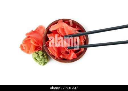 Bowl with pickled ginger, wasabi and chopsticks isolated on white background Stock Photo