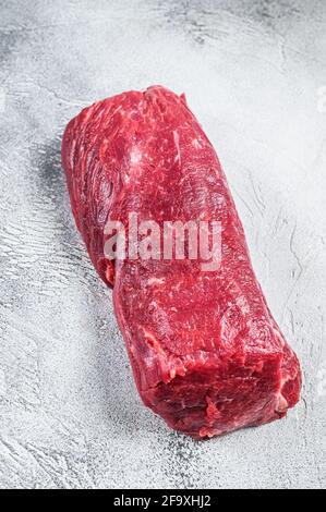 Whole Beef tenderloin meat, raw tender loin on butcher table. Black ...