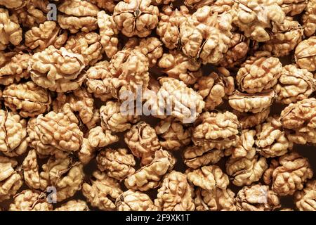 Background of fresh walnuts without shells. Food walnuts pattern or texture. Stock Photo
