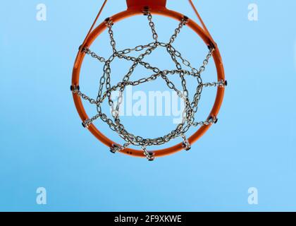 basketball rim with blue sky in the background. Basket Hoop On Sports. Copyspace. Stock Photo