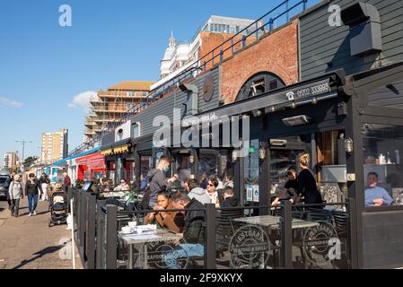The Arches cafe restaurants in Westcliff on Sea, Southend, Essex, UK, with diners outside in step 2 of the roadmap out of lockdown. Al fresco dining Stock Photo