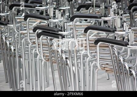 stacked chair skeletons in preparation to being refurbished Stock Photo