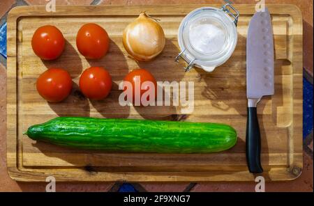 fresh salad ingredients on cutting board Stock Photo