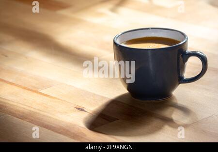 cup of coffee on wooden table Stock Photo
